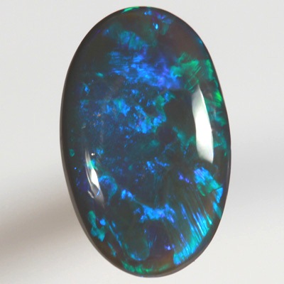 SOLID BLACK OPAL Bright electric peacock coloured roling flashes 